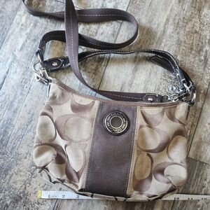 Coach handbag has silver hardware clean inside